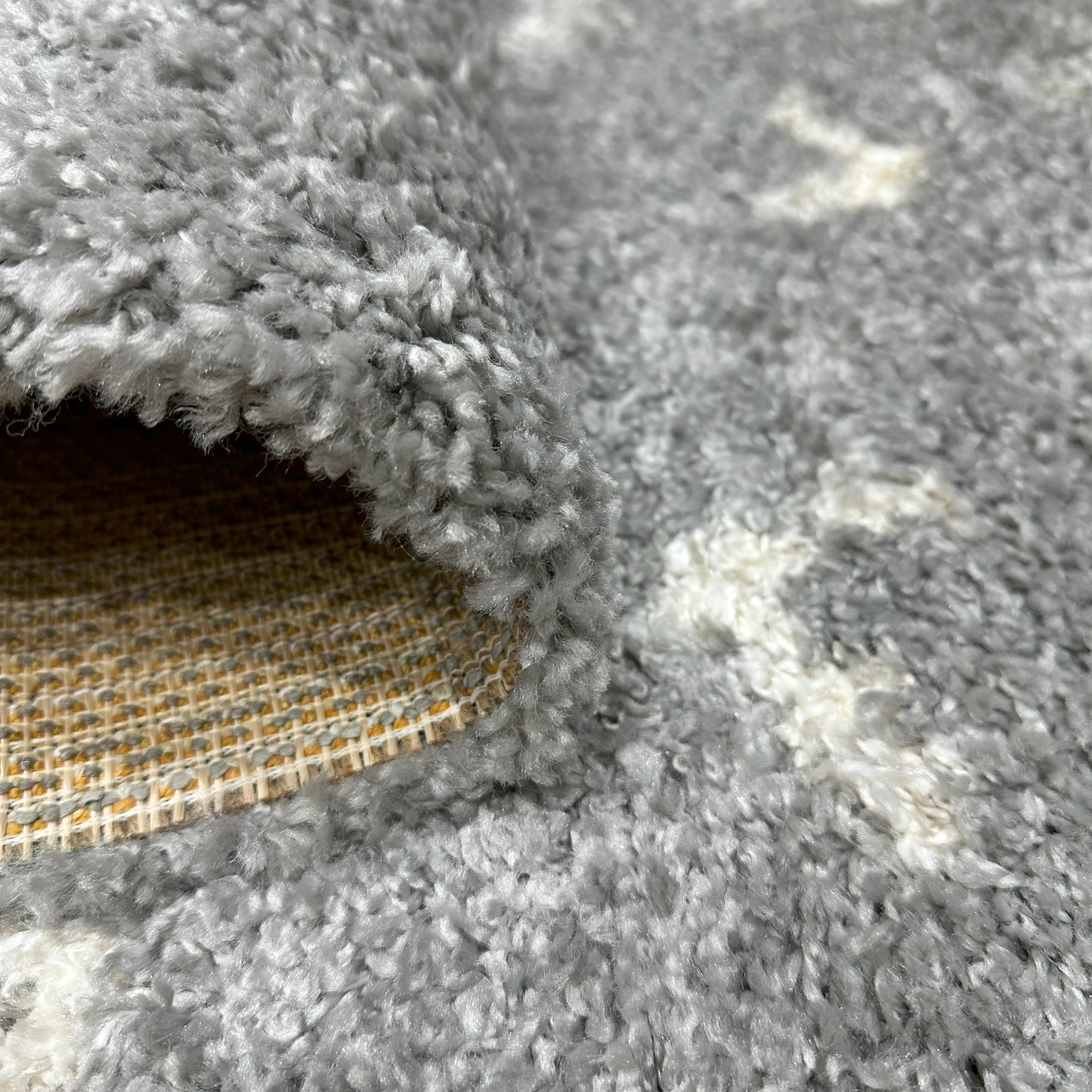 Cream and Grey 3D Shaggy Carpet, 120 x 170 cm - Soft and luxurious home decor, showing the thickness of the carpet.